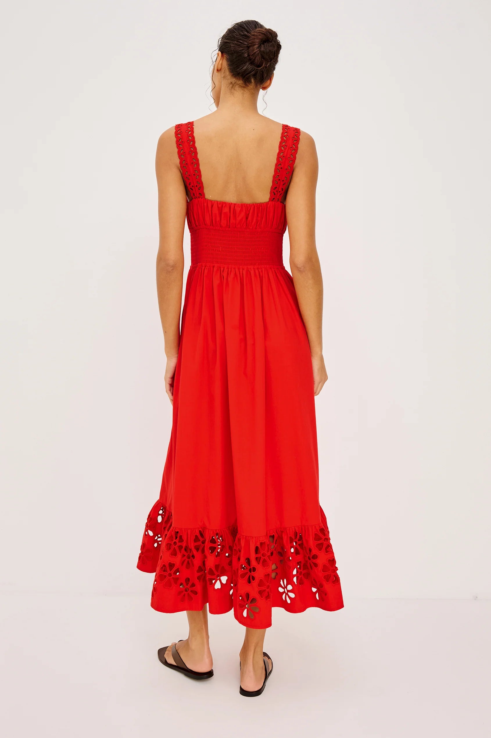 Red dress with floral hem on a white background