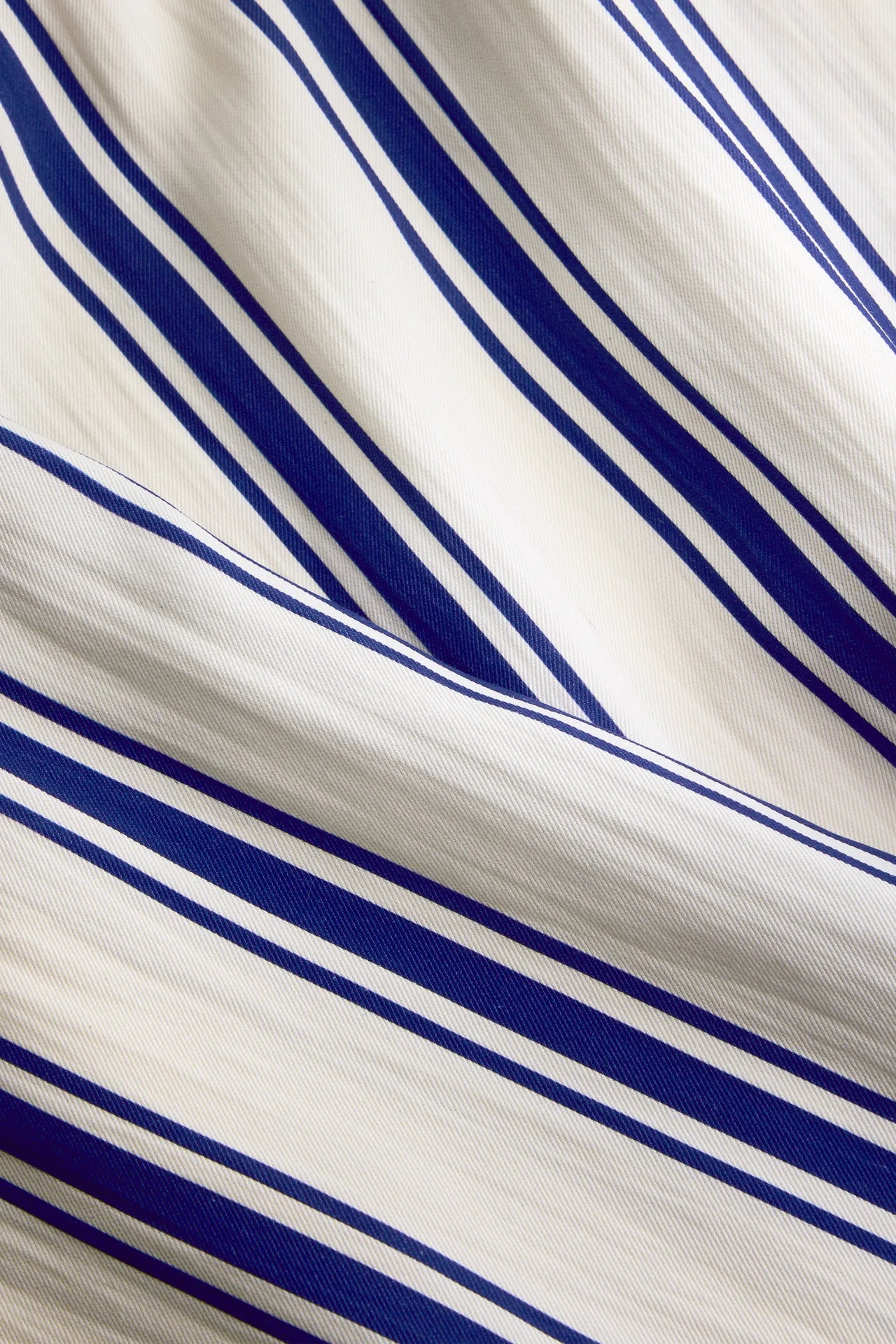 Close-up of fabric with blue and white stripes