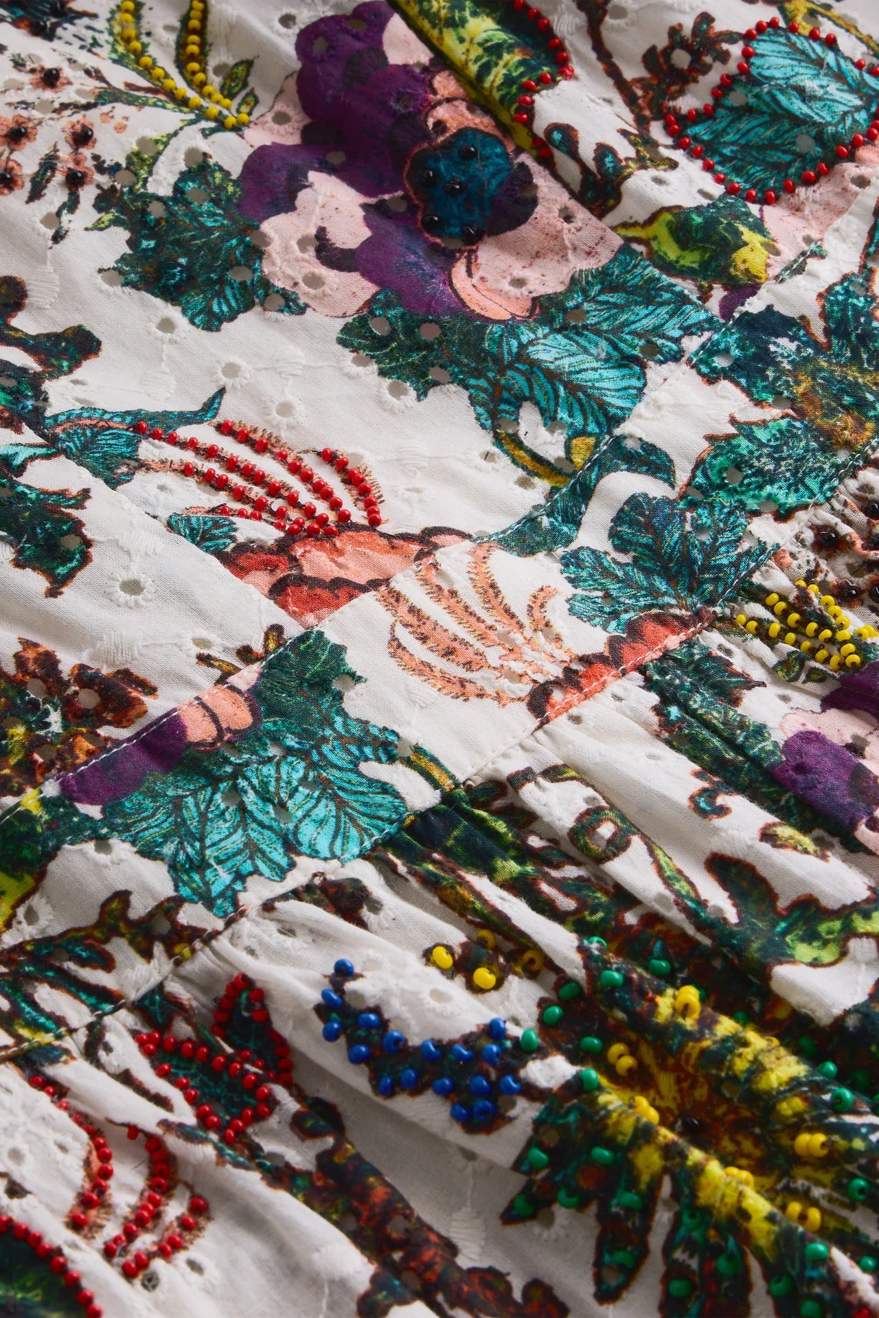 Close-up of a colorful embroidered fabric with floral patterns