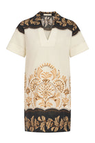Short-sleeve blouse with intricate black, gold, and white patterns on a white background