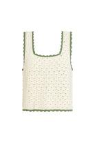 Crocheted tank top with green trim on a white background