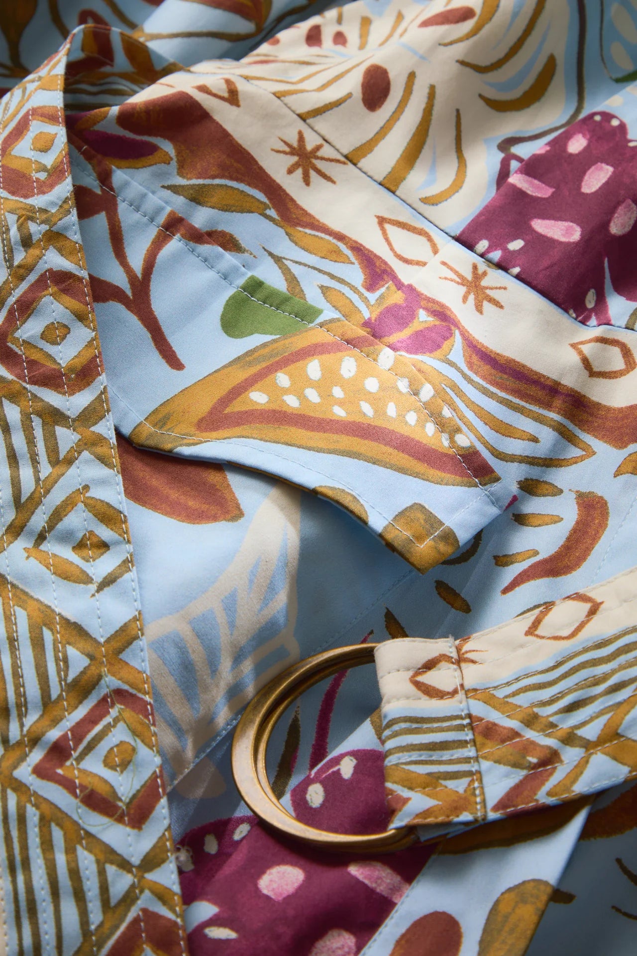 Close-up of a patterned fabric with geometric and abstract designs.