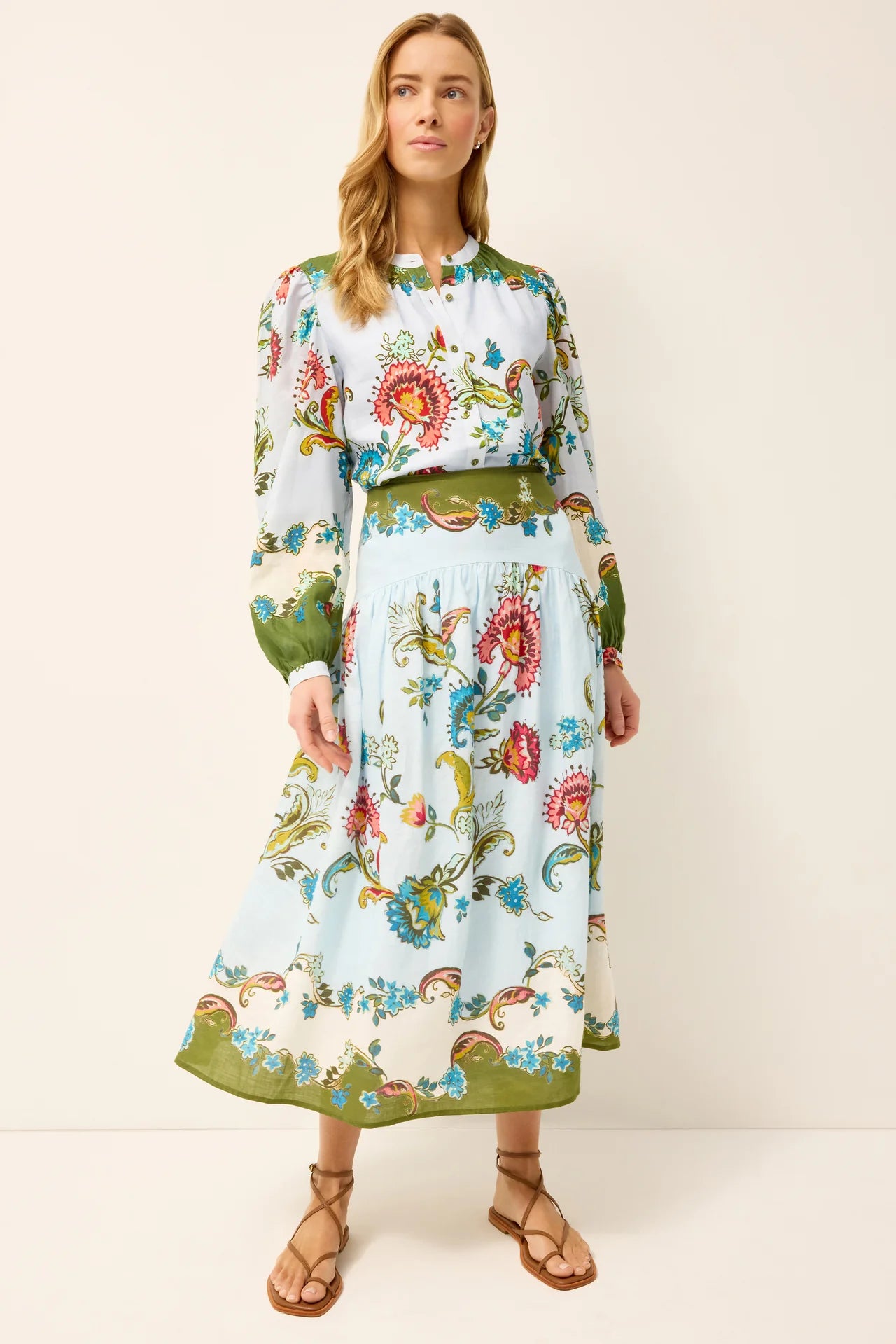 Woman wearing a floral dress with a white background