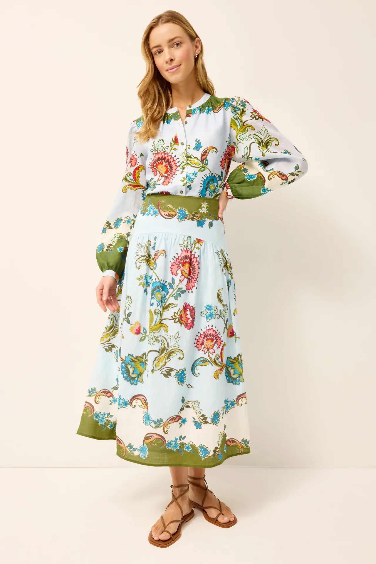 Woman wearing a floral dress with a white background