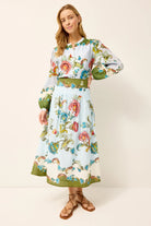 Woman wearing a floral dress with a white background