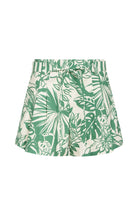 Green and white tropical leaf patterned skirt on a white background