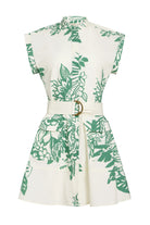 White dress with green leaf pattern and belt on a white background