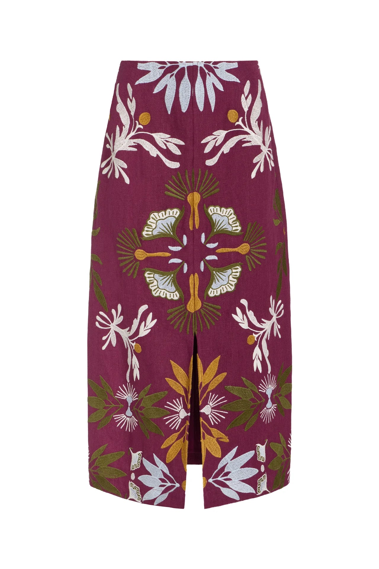 A high-waisted midi skirt with a front slit, featuring a vibrant magenta base with a detailed botanical and floral pattern in white, olive green, mustard yellow, and light blue, shown against a plain white background.