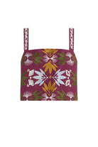A square crop top featuring a deep magenta base with a symmetrical botanical pattern in olive green, mustard yellow, and white, complete with matching patterned shoulder straps.