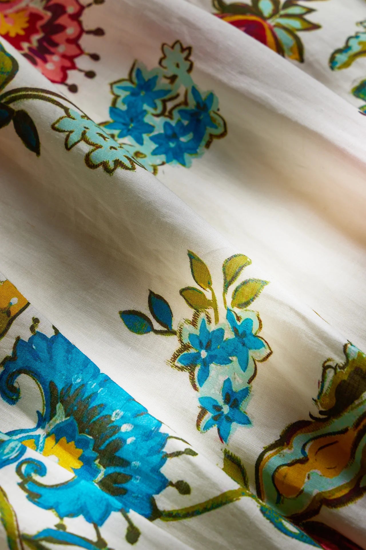 Close-up of colorful floral and abstract patterns on fabric