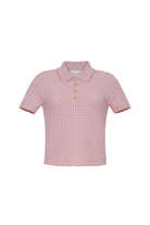 Pink checkered polo shirt on a white background