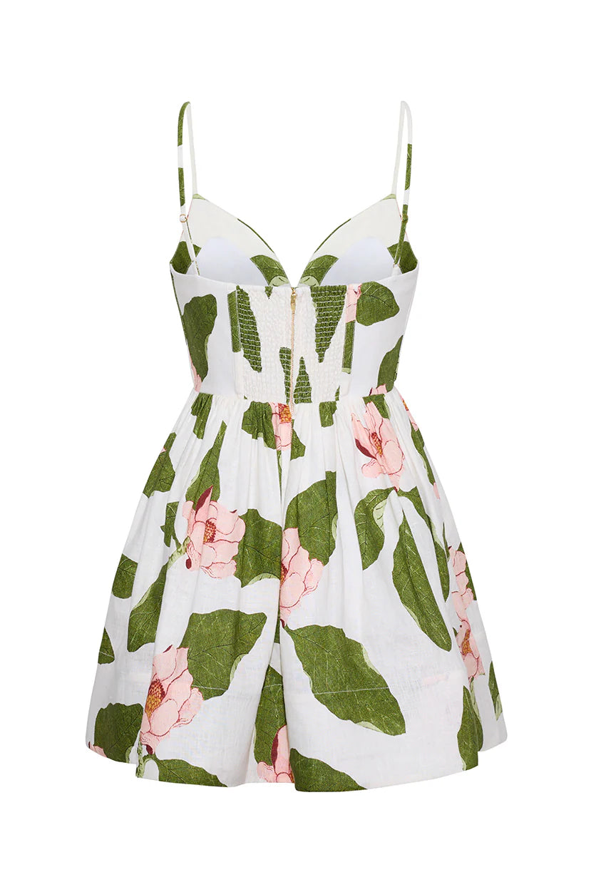 Floral dress with green leaves and pink flowers on a white background