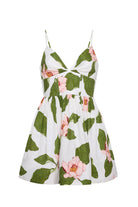 Floral dress with green leaves and pink flowers on a white background