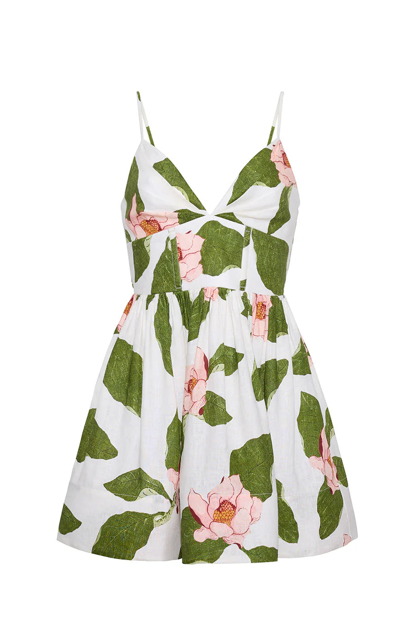 Floral dress with green leaves and pink flowers on a white background