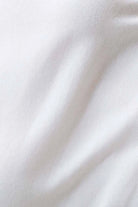 Close-up of white fabric with soft folds