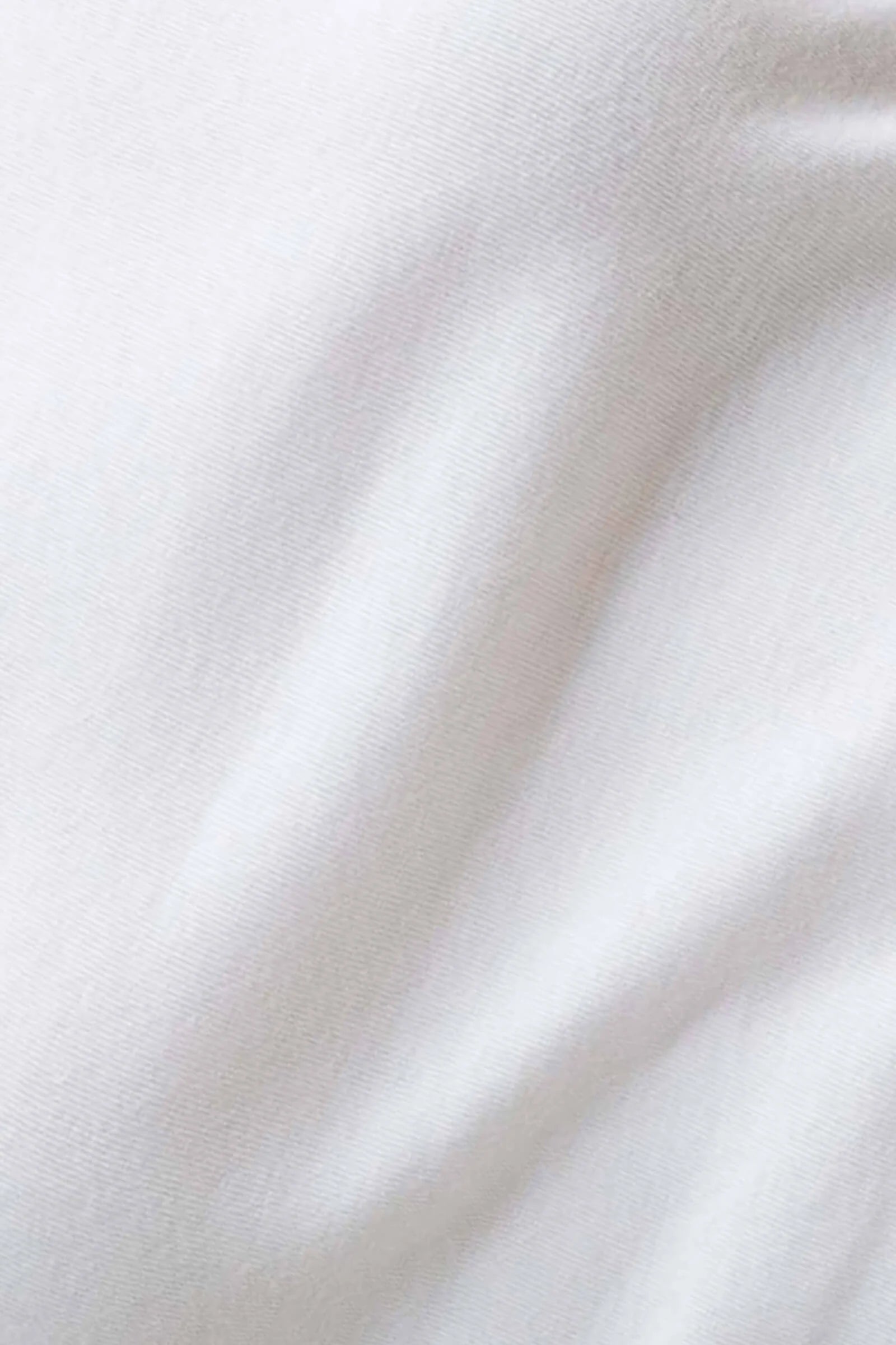 Close-up of white fabric with soft folds
