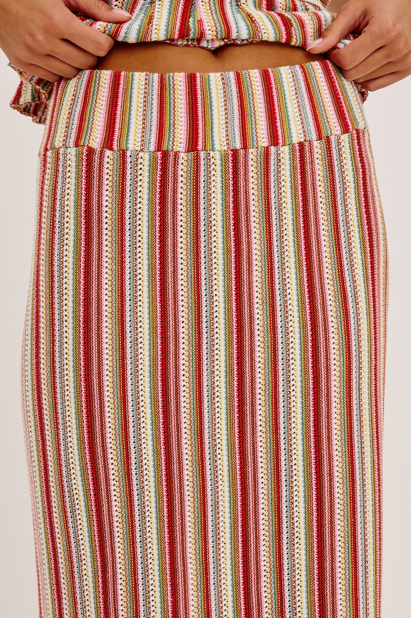 Multicolored striped skirt with a plain background