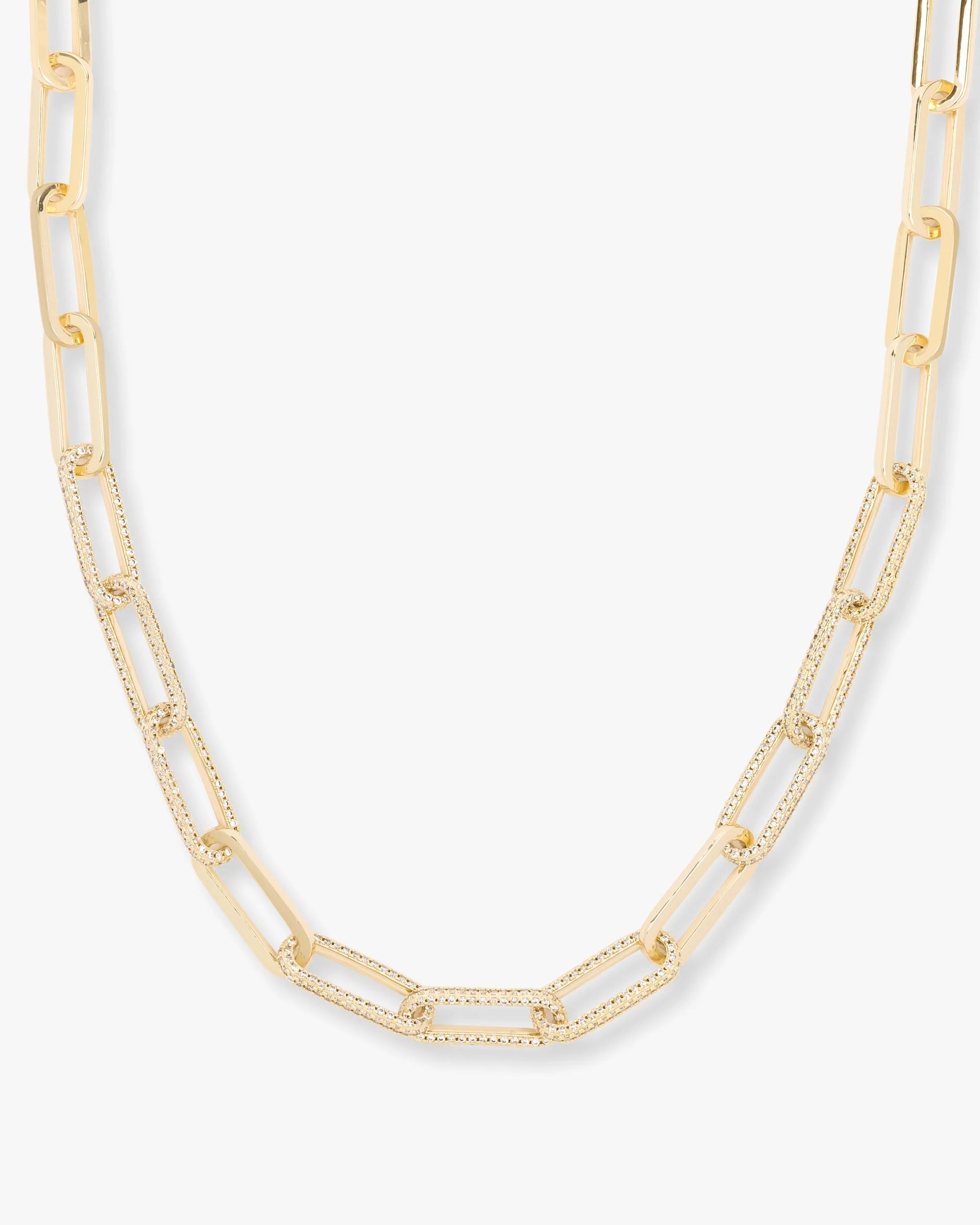 Gold chain necklace on a white background