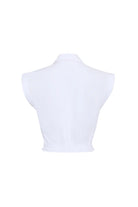 White sleeveless top on a mannequin against a white background