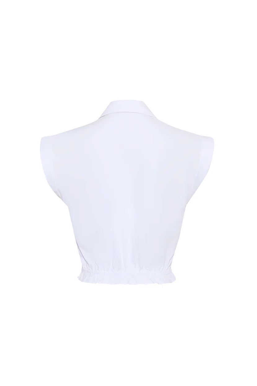 White sleeveless top on a mannequin against a white background