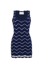 Navy dress with white wave pattern on a white background