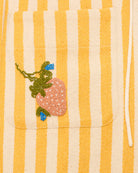 Striped fabric with embroidered flower design on a yellow and white background