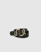 Black belt with a gold snake-shaped buckle on a light gray background