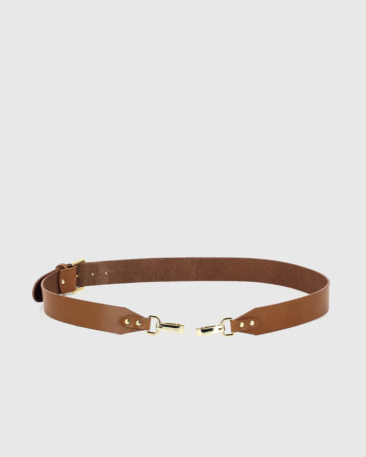 Brown belt with gold hardware on a light gray background