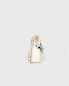 Gold ring with a heart design on a light gray background