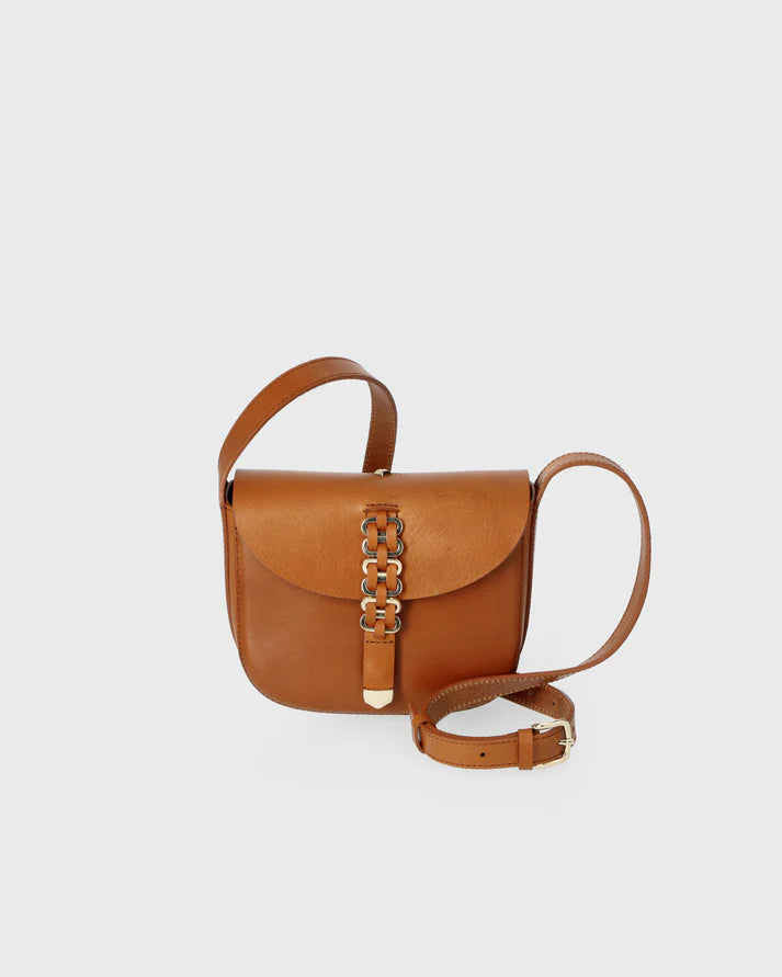 Brown leather handbag with chain detail on a light gray background