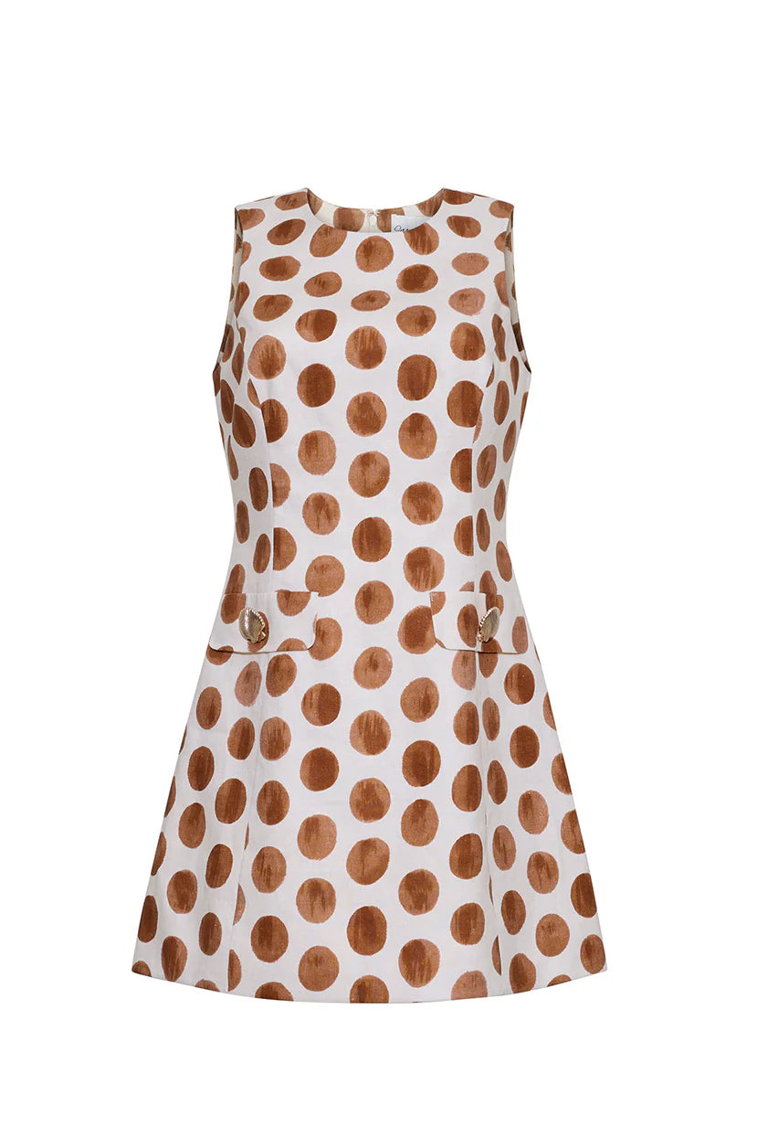 White dress with brown polka dot pattern on a white background