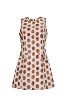 White dress with brown polka dot pattern on a white background
