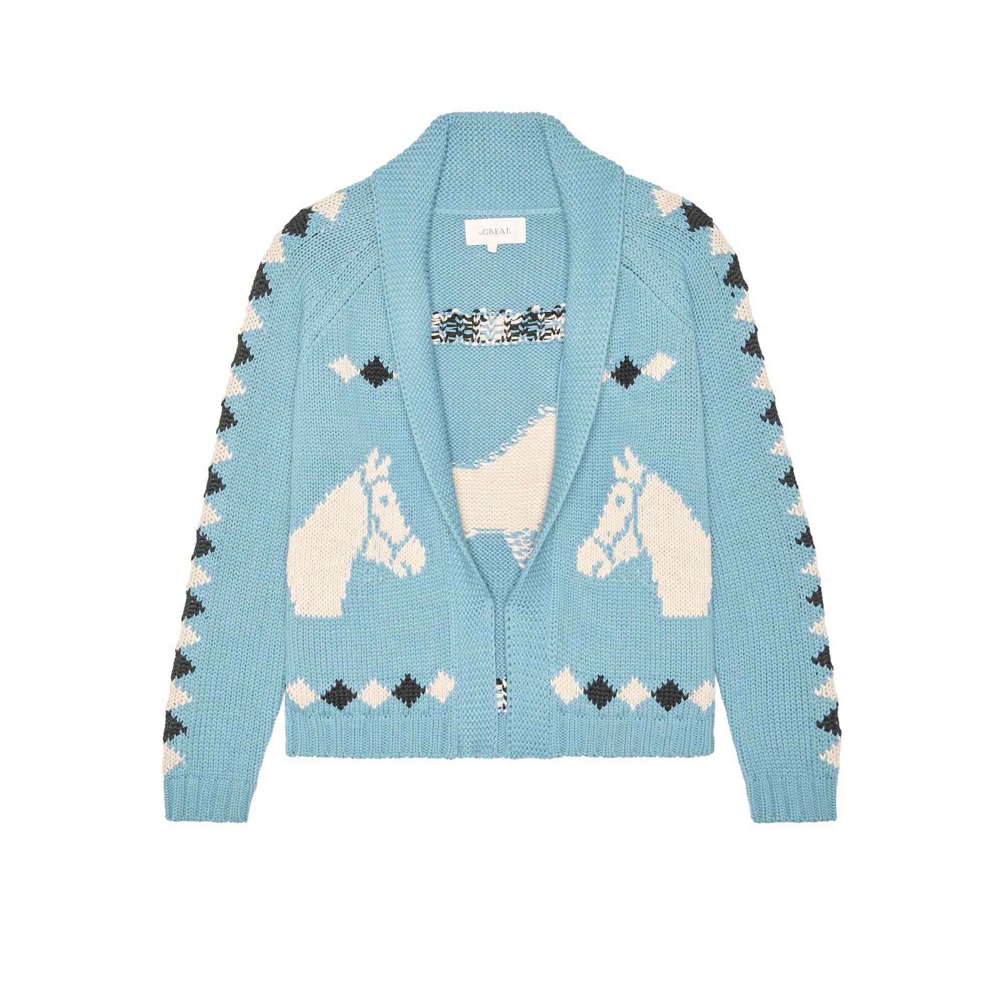Light blue cardigan with unicorn pattern on a white background