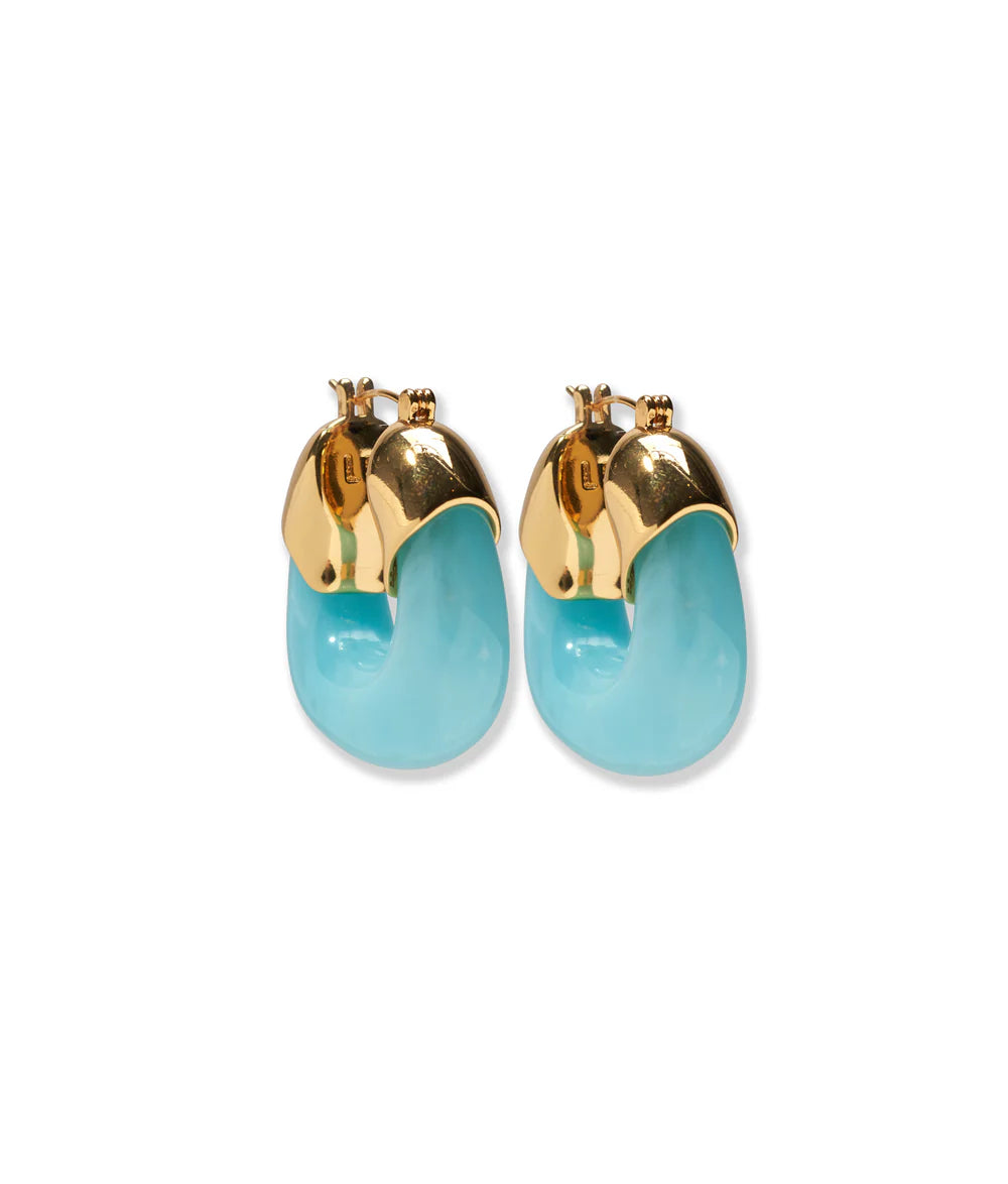 Gold hoop earrings with turquoise stones on a white background