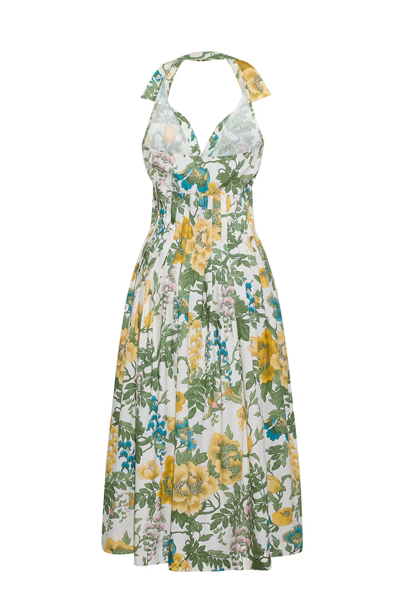 Floral dress with yellow and green flowers on a white background