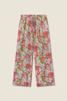 Floral patterned pants on a beige background