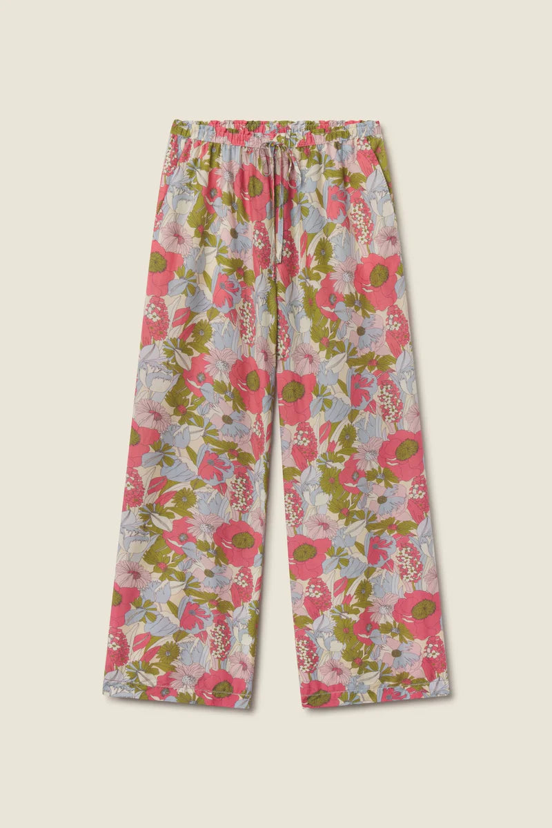 Floral patterned pants on a beige background