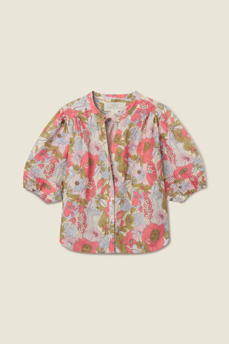 Floral patterned shirt on a beige background