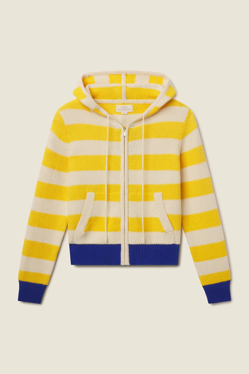 Yellow and white striped hoodie with blue accents on a beige background