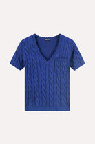 Blue cable knit sweater with a pocket on a white background