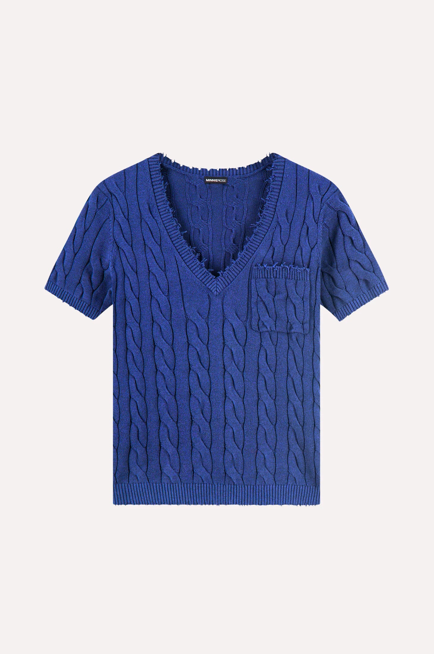 Blue cable knit sweater with a pocket on a white background