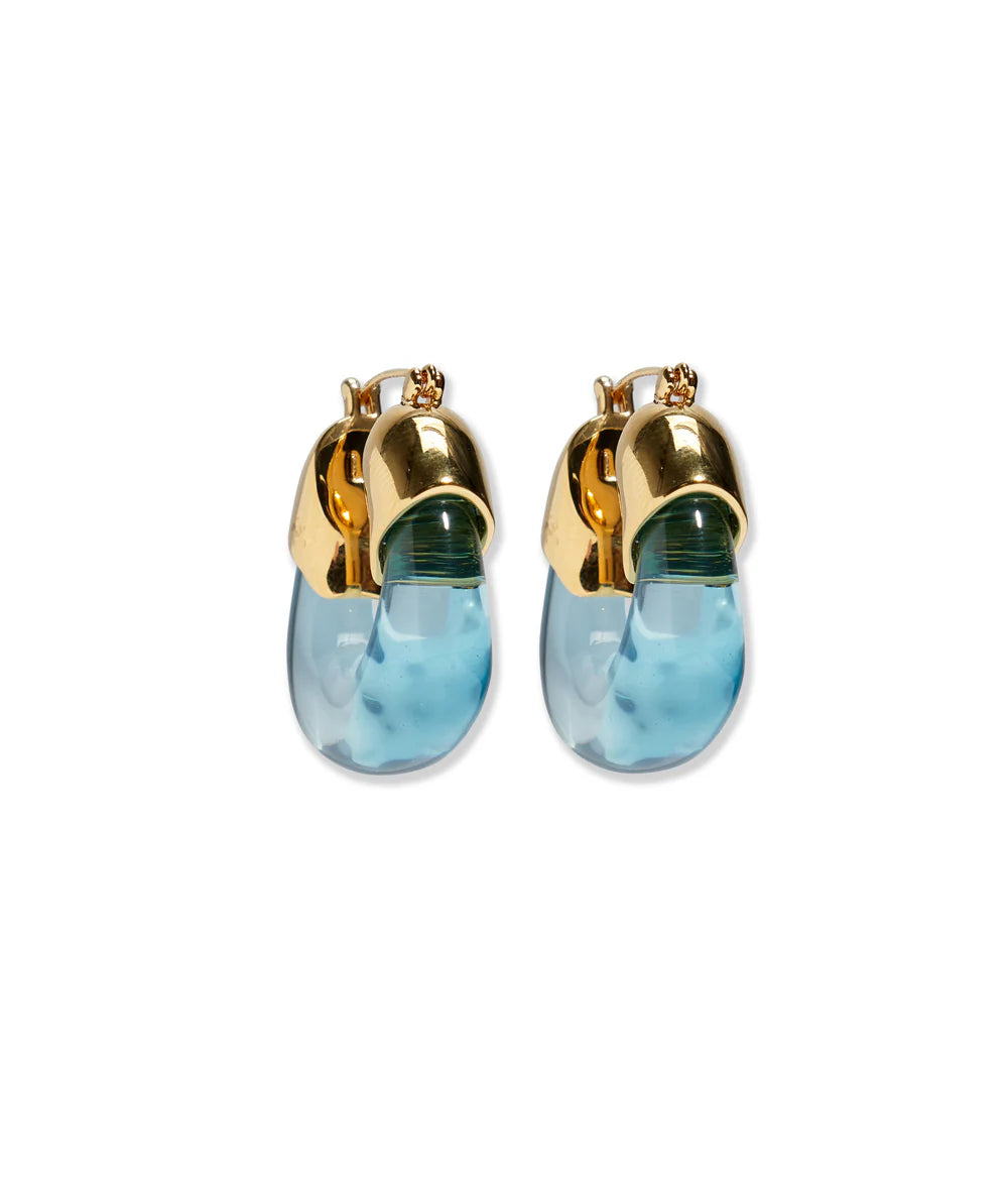 Gold and blue earrings on a white background