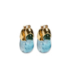 Gold and blue earrings on a white background