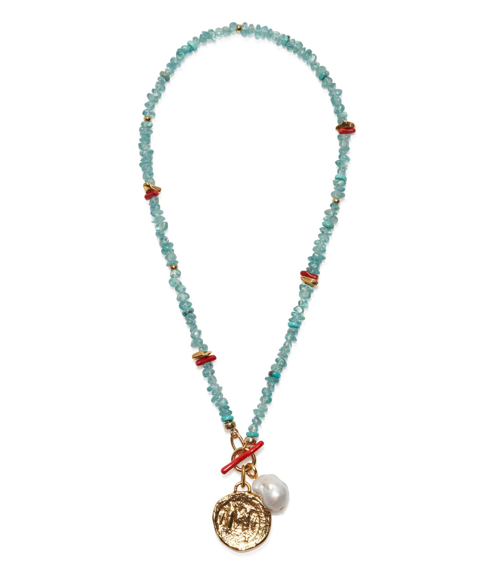 Necklace with beads and charms on a white background