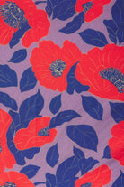Pattern of red and blue flowers on a purple background