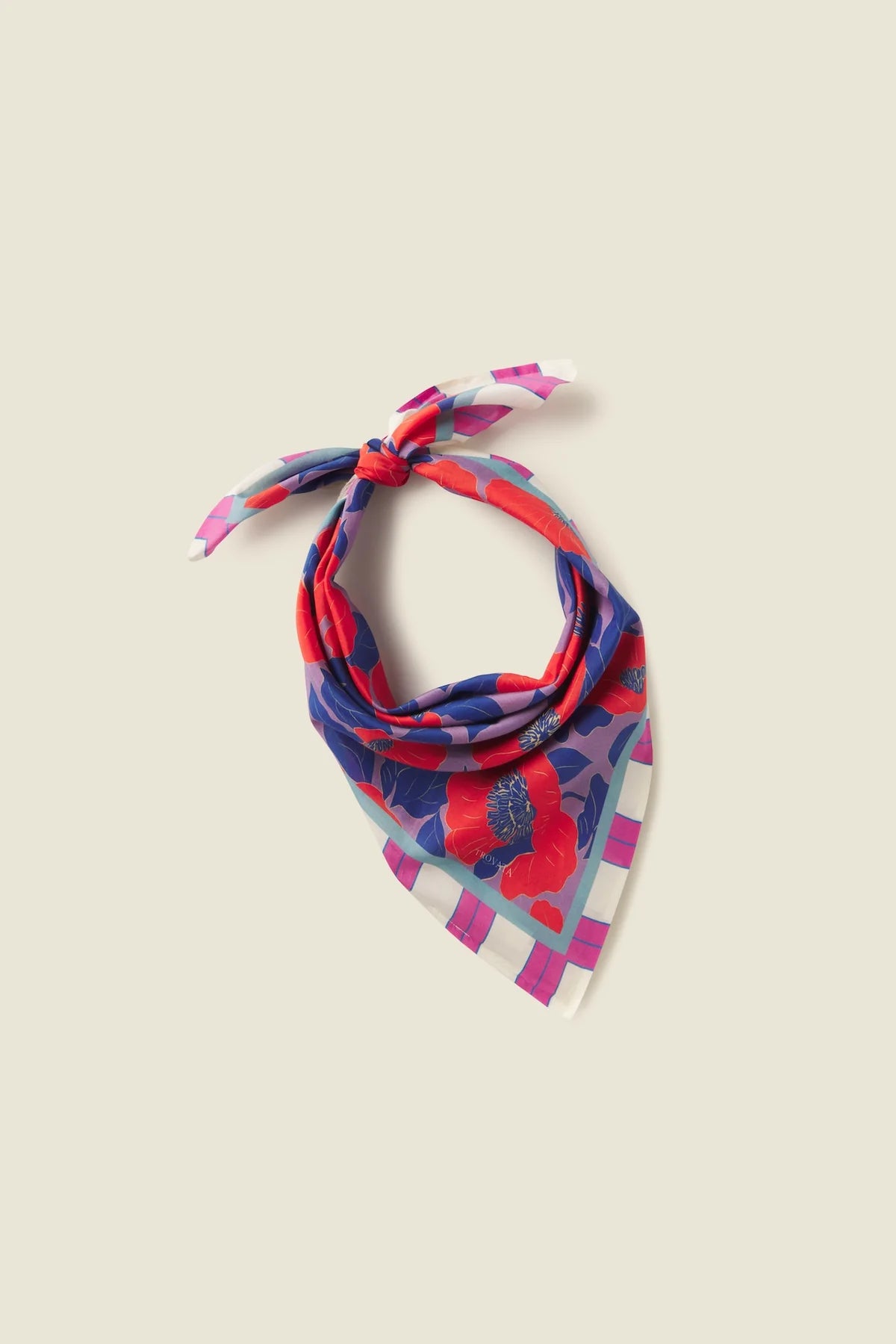 Colorful patterned bandana on a beige background