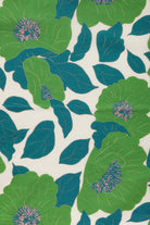 Pattern of green and blue flowers on a white background