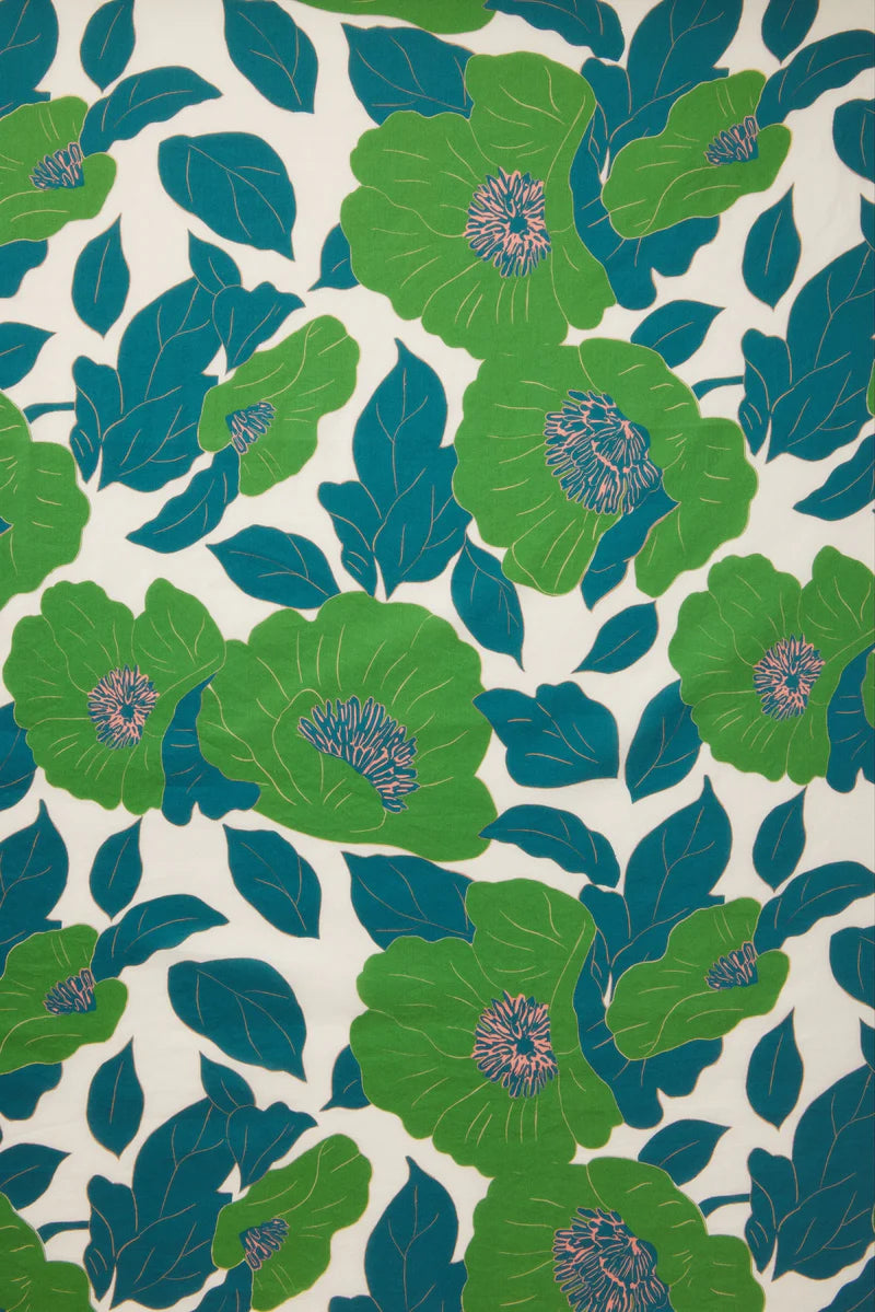 Pattern of green and blue flowers on a white background