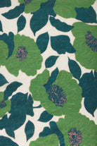 Pattern of green and blue flowers on a white background
