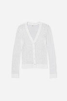White textured cardigan on a light gray background